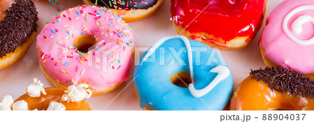 sweet doughnuts on gray stone background 88904037
