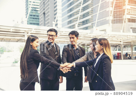 Group of diversity people fist bump holding hands together power of tag team. Teamwork Multiethnic people group working togetherness. Business people team holding hands successful. Business meeting 88904519