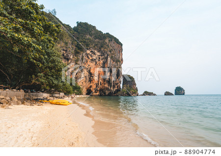 sea, beach and rocky mountains in tropical evening sea, beach and rocky mountains in tropical evening 88904774