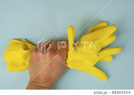 a yellow rubber cleaning glove 88905959