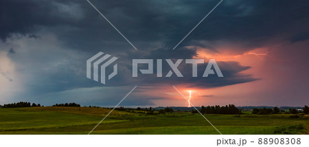 Thunder storm clouds with lightning strikes across the fields, summer, Lithuania 88908308
