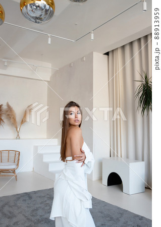 Attractive woman in white sleepwear Attractive woman in white sleepwear 88913959