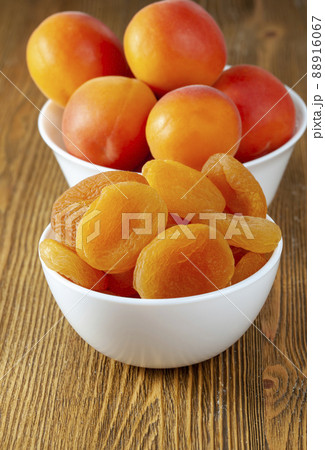 orange sweet apricots on the table in the kitchen 88916067