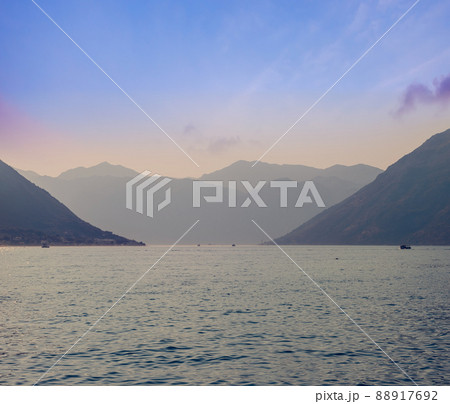 Sunset, beautiful landscape with silhouettes of trees. Travel concept. Montenegro, Kotor Bay. Sunset at Kotor Bay Montenegro. View of the sunset in Boko-Kotor Bay in Montenegro. Silhouettes of Sunset, beautiful landscape with silhouettes of trees. Travel concept. Montenegro, Kotor Bay. Sunset at Kotor Bay Montenegro. View of the sunset in Boko-Kotor Bay in Montenegro. Silhouettes of 88917692