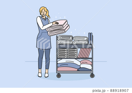 Smiling housekeeper with trolley with clean towels Smiling housekeeper with trolley with clean towels 88918907