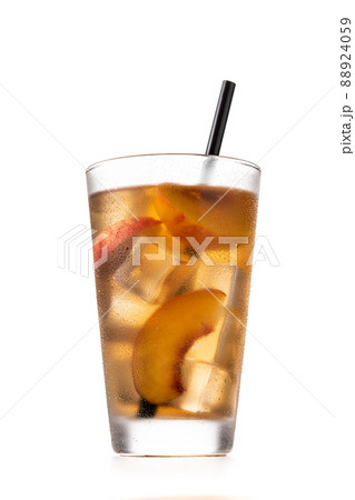 Glass of peach tea with ice cubes Glass of peach tea with ice cubes 88924059