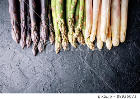 Green asparagus sprout on black board 88926073