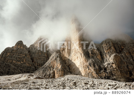 Incredible view of the Three Peaks of Lavaredo in morning fog Incredible view of the Three Peaks of Lavaredo in morning fog 88926074