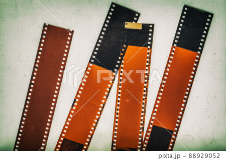 Set of 35mm negative film strip, vintage background with intentional grain, noise, dust, scratches 88929052