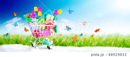 Mini shopping cart with colorful flowers and butterflies. 88929832