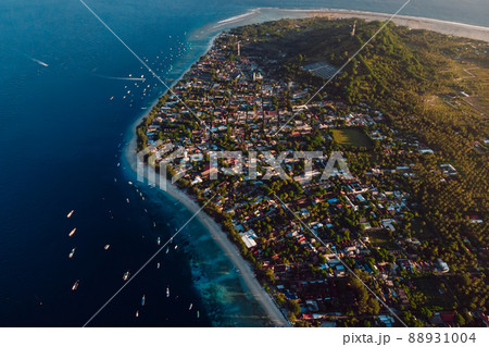 Tropical island Gili Trawangan with beach, boats and ocean. Aerial view. Tropical island Gili Trawangan with beach, boats and ocean. Aerial view. 88931004