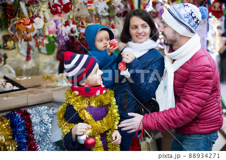 Family of four buying holidays decorations 88934271