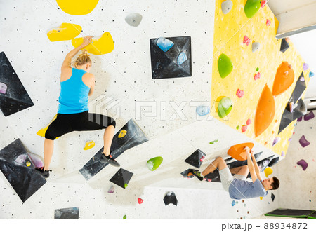 Climbing training on an artificial climbing wall indoor 88934872