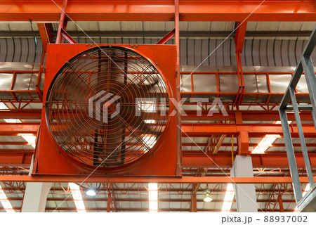Big industrial cooler red fans in factory for reduced heat in operation 88937002