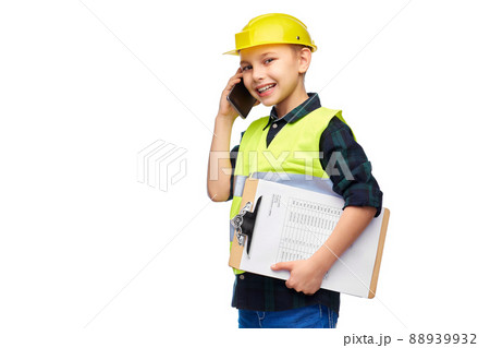 boy in helmet with clipboard calling on phone boy in helmet with clipboard calling on phone 88939932