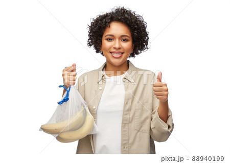 happy woman with bananas in reusable string bag happy woman with bananas in reusable string bag 88940199