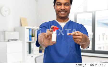 smiling doctor or male nurse with medicine 88940439