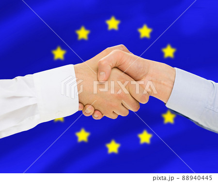 close up of handshake over flag of european union 88940445