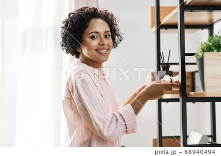 woman with aroma reed diffuser and cotton at home woman with aroma reed diffuser and cotton at home 88940494