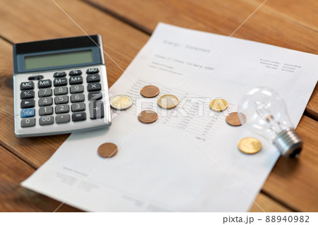 utility bill, calculator, money and lightbulb utility bill, calculator, money and lightbulb 88940982