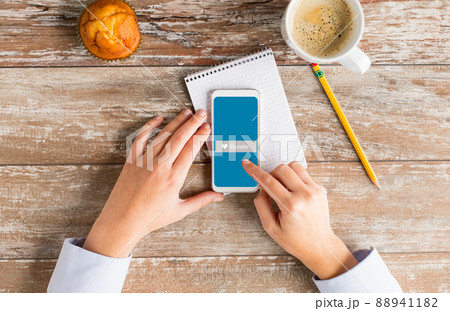close up of hands with laptop and smartphone 88941182