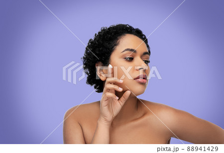 young african american woman with moisturizer young african american woman with moisturizer 88941429