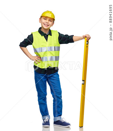 boy in construction helmet and vest with level boy in construction helmet and vest with level 88941695