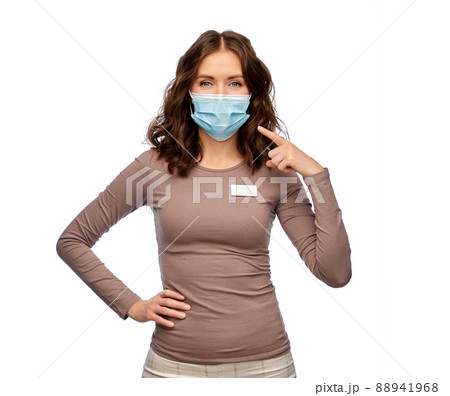 saleswoman showing medical mask on her face saleswoman showing medical mask on her face 88941968