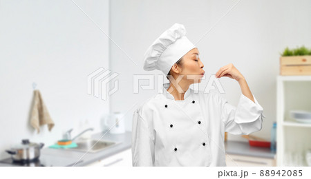 happy female chef making gourmet gesture 88942085