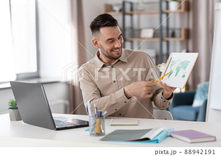 teacher with world map having online class at home 88942191