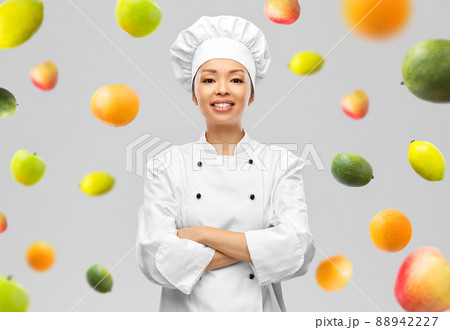 smiling female chef in white jacket smiling female chef in white jacket 88942227