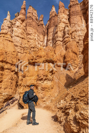 United States, Utah, Bryce Canyon National Park, Senior hiker with backpack exploring Bryce Canyon National Park United States, Utah, Bryce Canyon National Park, Senior hiker with backpack exploring Bryce Canyon National Park 88942576