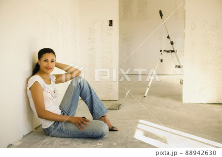 Young woman during house renovation 88942630