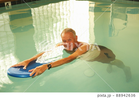 Senior man during hydrotherapy in swimming pool 88942636