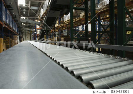 Conveyor belt in distribution warehouse 88942805