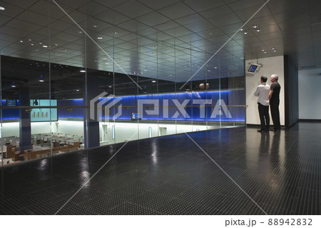 Businessmen watching data screen in modern office 88942832