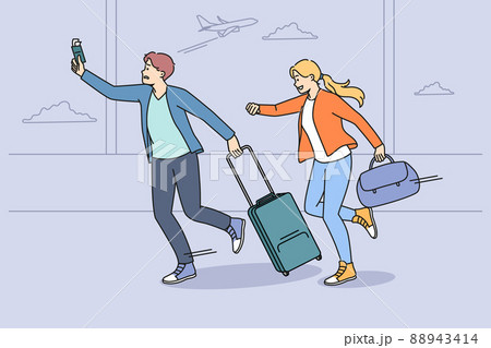 Worried tourists run for flight in airport 88943414