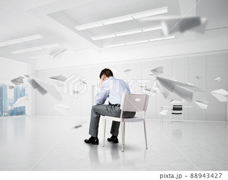 young businessman on chair in office young businessman on chair in office 88943427