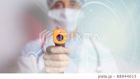 Scope over caucasian female health worker holding a temperature gun with copy space Scope over caucasian female health worker holding a temperature gun with copy space 88944015