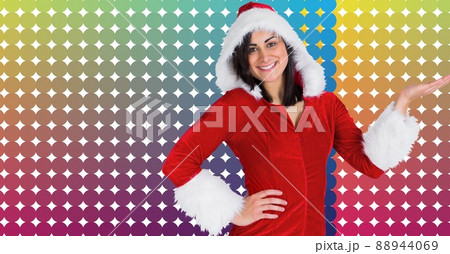 Portrait of caucasian woman in santa costume against colorful background with copy space Portrait of caucasian woman in santa costume against colorful background with copy space 88944069
