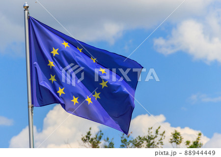 Waving flag of European Union against blue sky 88944449