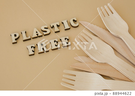 PLASTIC FREE text around Eco friendly, disposable, recyclable, compostable tableware. Paper food boxes, dishes on neutral beige background. Sustainable lifestyle concept. Flat lay PLASTIC FREE text around Eco friendly, disposable, recyclable, compostable tableware. Paper food boxes, dishes on neutral beige background. Sustainable lifestyle concept. Flat lay 88944622