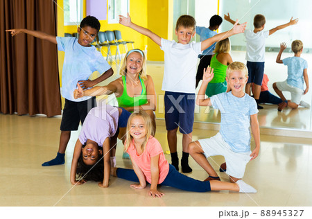 Positive children in dance studio smiling and having fun 88945327