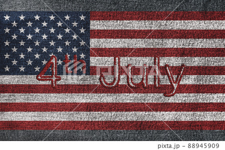4th of July text on American flag on denim jeans textured abstract background concept. The National indendence day on USA flag frabric texture. 4th of July text on American flag on denim jeans textured abstract background concept. The National indendence day on USA flag frabric texture. 88945909