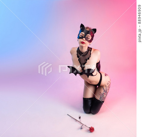sexy woman in a leather cat mask with a leather rose bdsm in underwear sexy woman in a leather cat mask with a leather rose bdsm in underwear 88946909