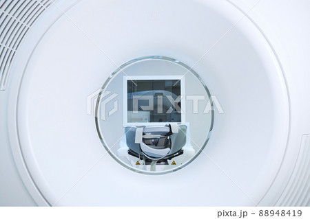 Bore view of modern MRI equipment with table and belts in clinic Bore view of modern MRI equipment with table and belts in clinic 88948419