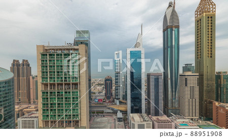 Panorama showing Dubai international financial center skyscrapers with promenade on a gate avenue aerial timelapse. Panorama showing Dubai international financial center skyscrapers with promenade on a gate avenue aerial timelapse. 88951908