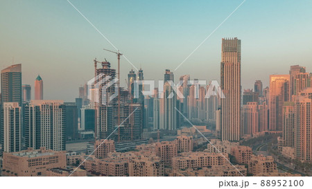 Dubai's business bay towers aerial morning timelapse. Rooftop view of some skyscrapers 88952100