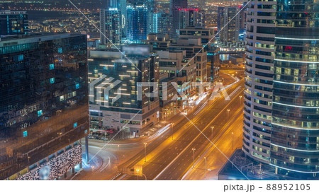 Dubai's business bay towers aerial night timelapse. Rooftop view of some skyscrapers 88952105