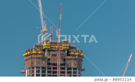 High multi-storey building under construction and cranes timelapse High multi-storey building under construction and cranes timelapse 88952114